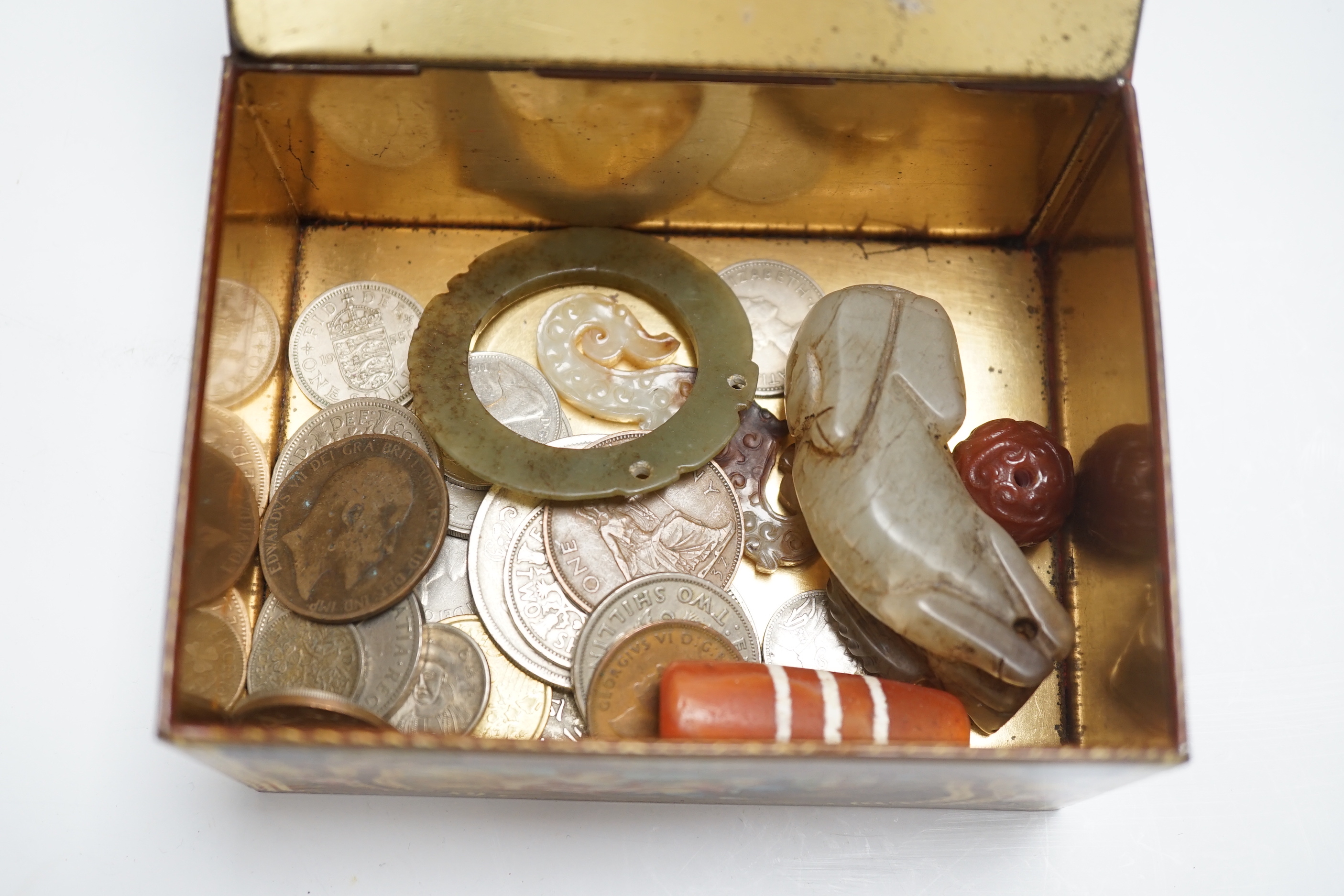 A group of various collectables including jades, coins, etc.